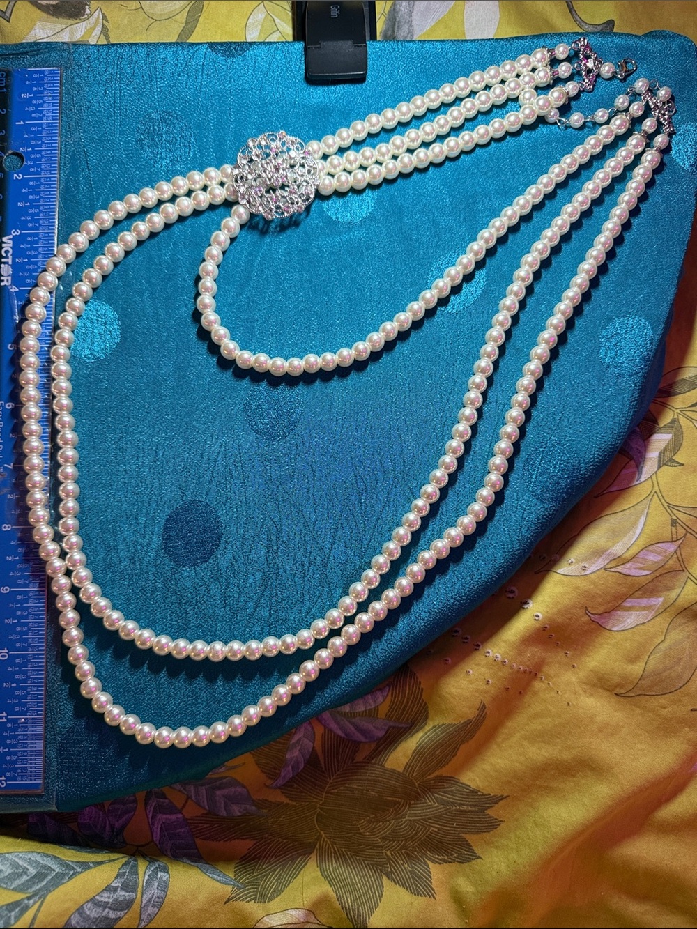 Elegant Pearl Triple-Strand Necklace with Rhinestone Accent